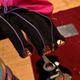 The custom glove controller that read players’ finger inputs. In the background can be seen the metal plate onto which the guitars were smashed.